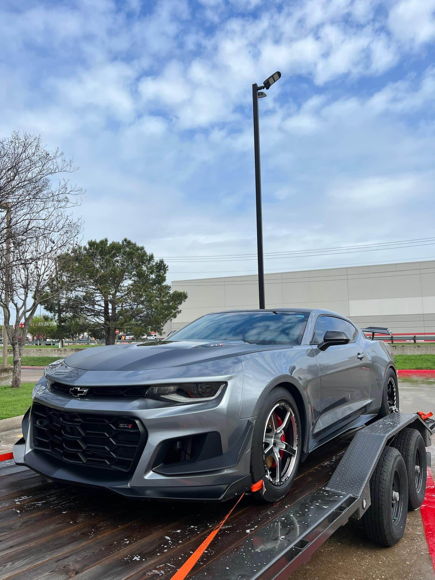 Professional auto detailer working on vehicle